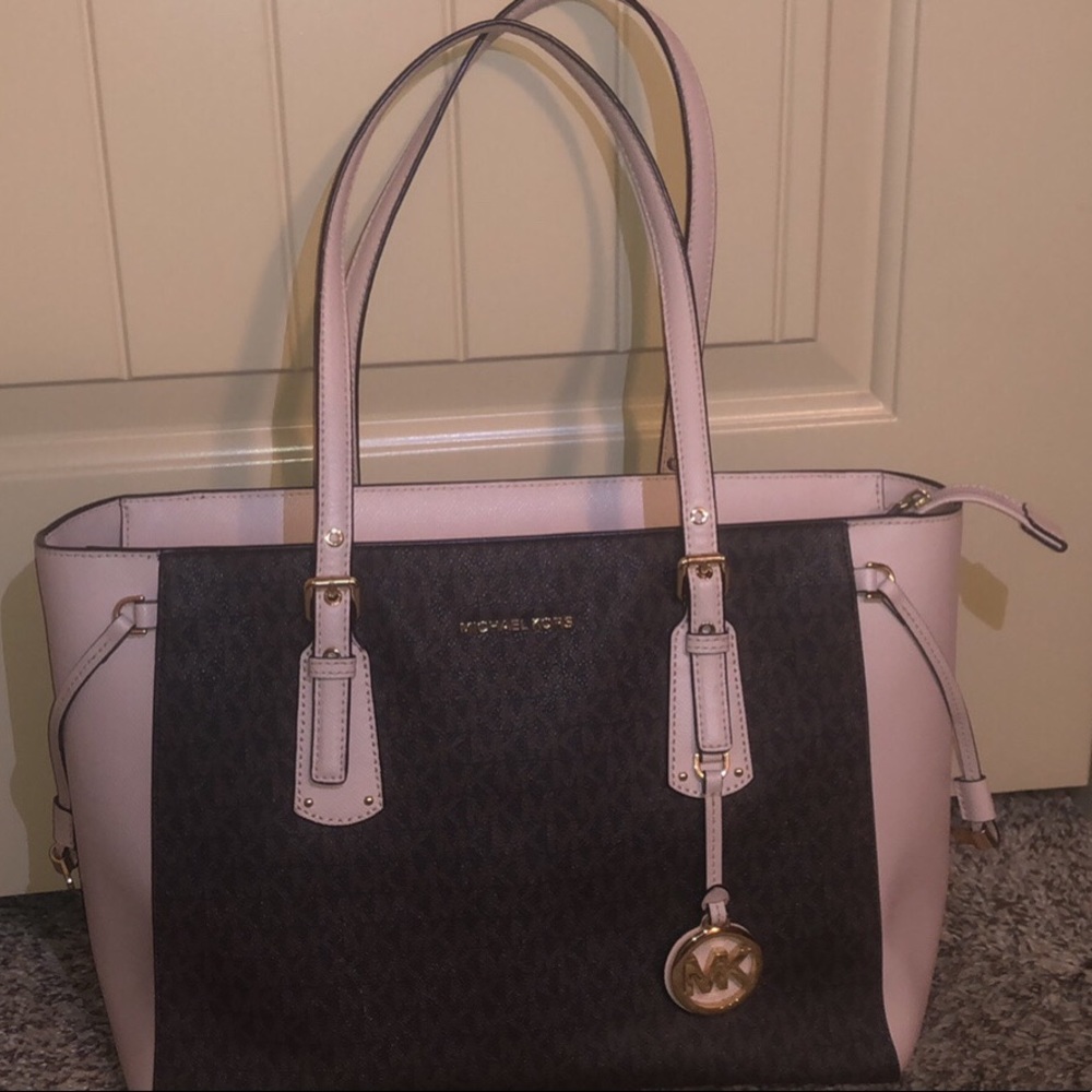 Purse-Brown leather with MK logo with pink trimming and Gold accents.
